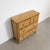 Vintage Riviera-style chest of drawers dating from the 1970s. The structure is covered in woven rattan and features four...