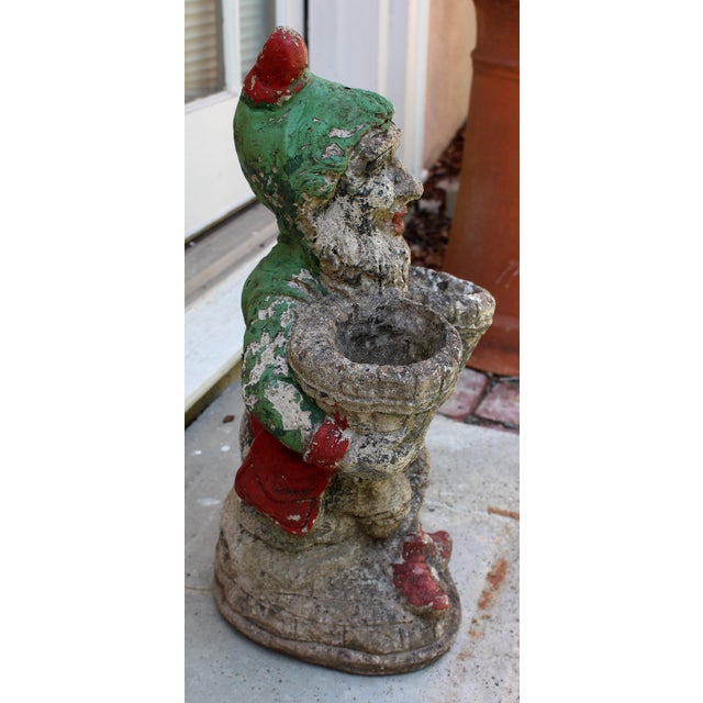 Large cast stone garden gnome double planter, English, mid-20th century. Seated, cross-legged gnome holding a little...