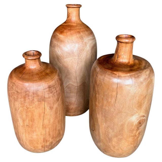 Three beautiful containers hand carved from century old mahogany wood. These are all solid wood and are therefore stable...