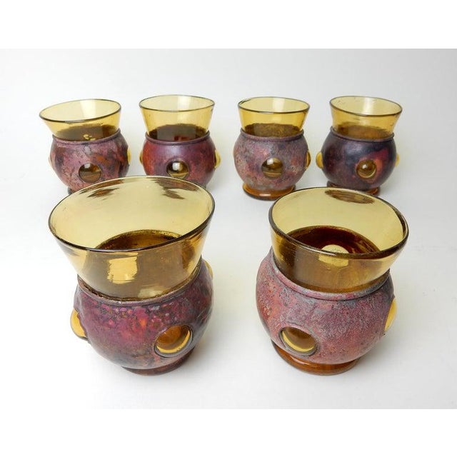 This is a gorgeous set of hand blown art glasses designed by Felipe Derflingher . Formed of torched copper sleeves and...