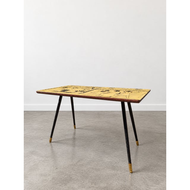 An elegant 1950s Italian coffee table, a perfect example of Midcentury Modern design. This piece stands out for its...