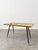An elegant 1950s Italian coffee table, a perfect example of Midcentury Modern design. This piece stands out for its...