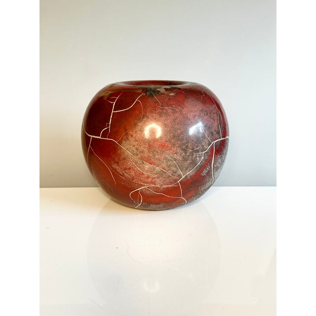 Expressive, handcrafted studio ceramic by Uwe Schellbach, Blankenburg, 1980s. Spherical, organic form with a blood-red,...