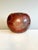 Expressive, handcrafted studio ceramic by Uwe Schellbach, Blankenburg, 1980s. Spherical, organic form with a blood-red,...