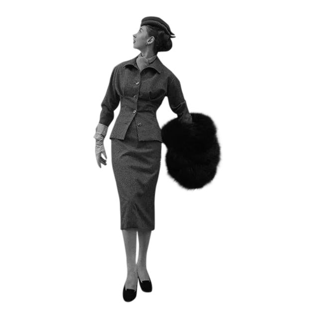 August 29, 1953: A model wearing a muff and suit outside Christian Dior's boutique in Paris. (Photo by Kurt Hutton/Picture...