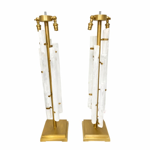 This sculptural pair reflects an early-2000s approach to high-end decorative lighting where natural materials are...