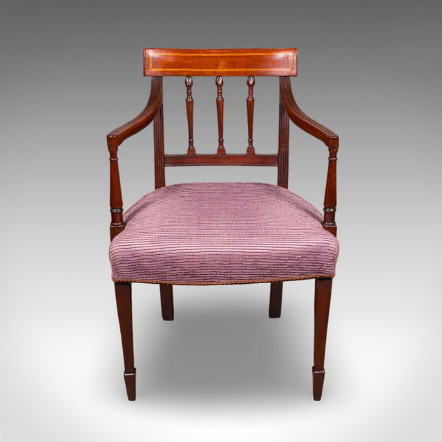 This is an antique morning room chair. An English, mahogany desk, reception hall or elbow seat, dating to the Regency...