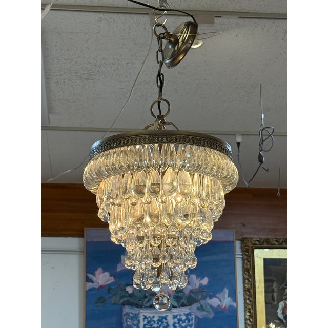 Design Plus Gallery presents a Clarissa Round Chandelier by Pottery Barn. Glass drops suspended from an antique-silver...