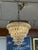 Design Plus Gallery presents a Clarissa Round Chandelier by Pottery Barn. Glass drops suspended from an antique-silver...