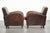 Set of 2 sturdy vintage sheepskin armchairs with a beautiful design and good seating comfort. This set of 2 sturdy vintage...