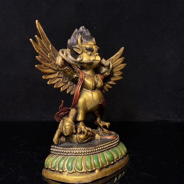 This is a finely crafted antique gilt bronze sculpture of a Garuda, a mythical bird-like creature revered in both Hindu...