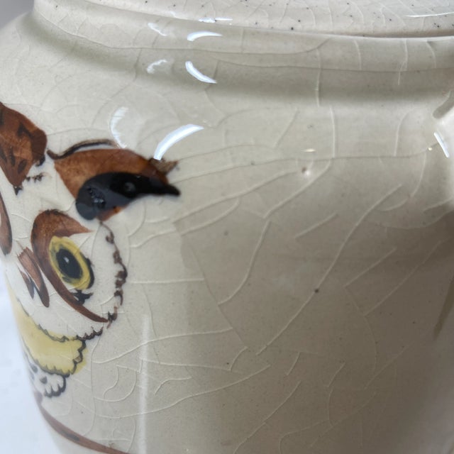 Here is a vintage teapot with a sweet owl hand painted on the front. There is a natural bamboo handle.