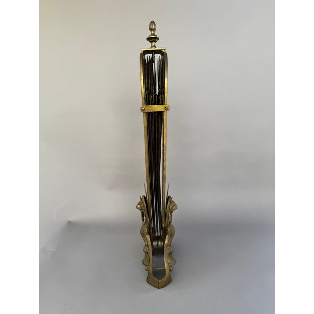 This exquisite antique fire guard dates to the early 1900s and features an iconic peacock fan design, paired with a bold...