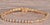 The Valley Center: Yellow Gold Martini Set Diamond Bracelet. The bracelet features three prong or martini set round...