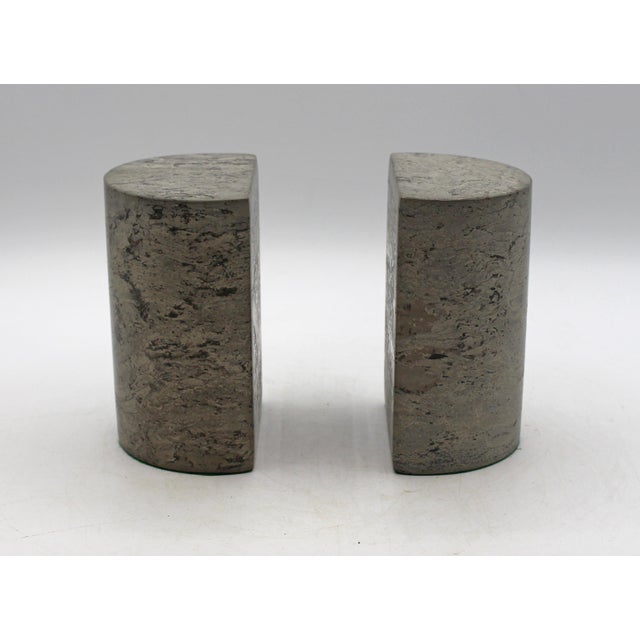Pair of turned Permian Period stone bookends from the San Andres Formation. Polished blue-grey stone, demilune form....