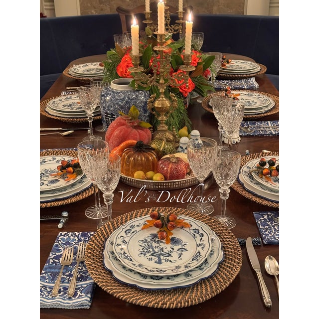 Presenting a pair of brass three arm candelabras in the Baroque style. The candle holders are each supported by bobeches...