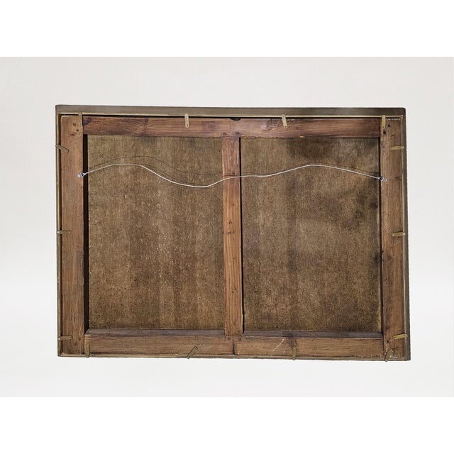 Most likely originally conceived as a firescreen, this piece is set within a giltwood frame. The block-printed paper panel...