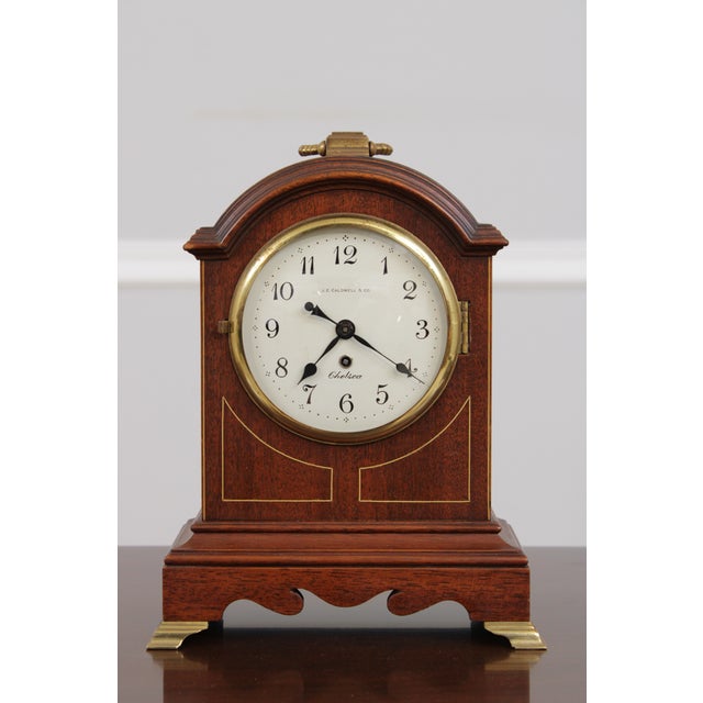 Age: Approx. 40 Years Old Details: Key Wind Movement Mahogany Bracket Feet Brass Capped Feet High Quality Construction...
