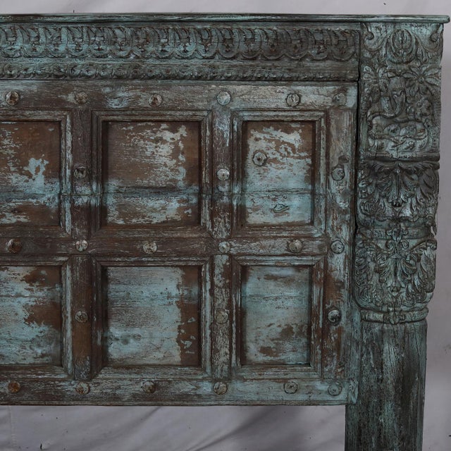 Constructed from a set of antique Indian 19th century teakwood doors from Rajasthan, this king-size bed transforms...