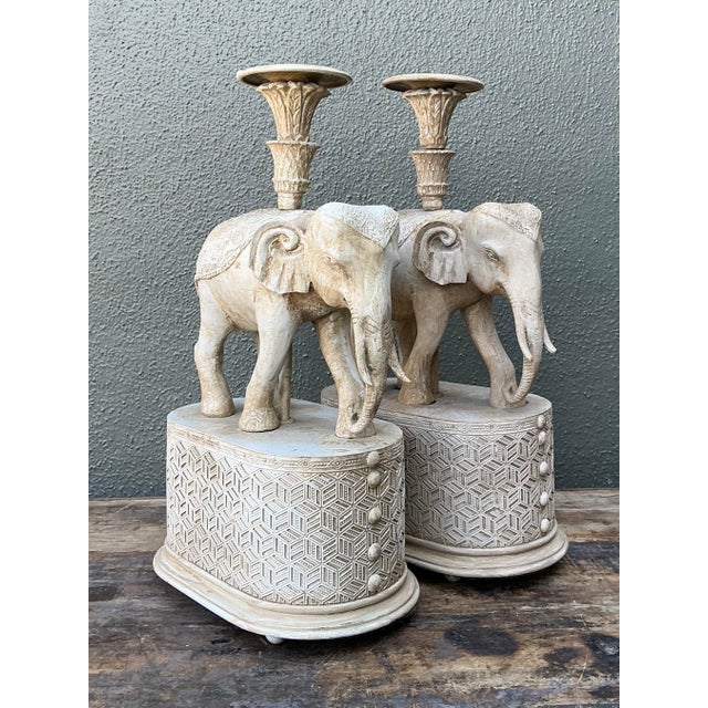 Infuse your home with a sense of global grandeur with this striking pair of Regency-style elephant candle holders. Each...