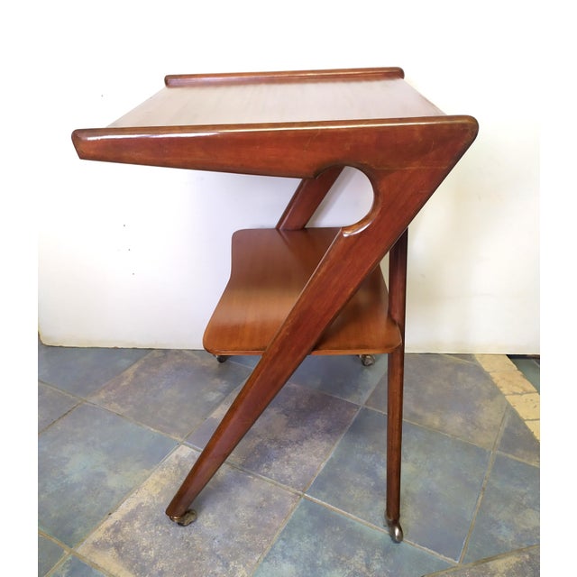 This TV stand was manufactured in Italy in the 1950s and designed to accommodate the early television sets produced during...