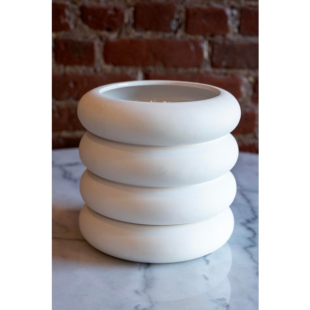 White ceramic tabletop stacking planter manufactured by Areaware. Has drainage and a cleverly integrated saucer. Designed...