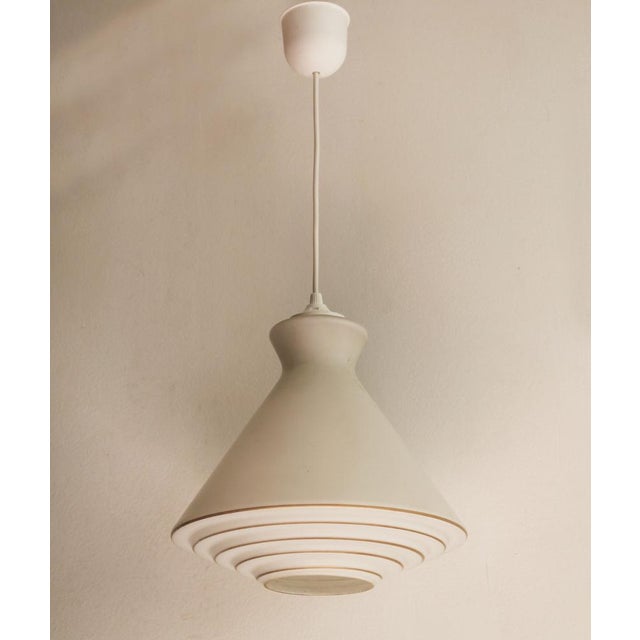 This original 1960s ceiling light was most likely produced in former Czechoslovakia and reflects the forward-looking...