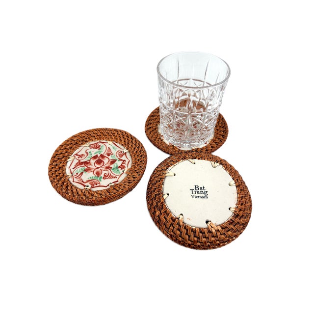 A distinctive set of four handcrafted coasters from Bat Trang, Vietnam, combining traditional Vietnamese glazed ceramics...