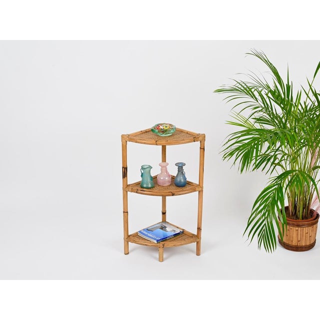 Wonderful mid-century bamboo and rattan triangular corner shelf, fully handmade in curved bamboo, rattan and hand-woven...