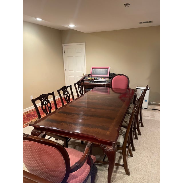 Authentic Maitland-Smith dining set consisting of a mahogany dining table with leaf extension, six matching Maitland-Smith...