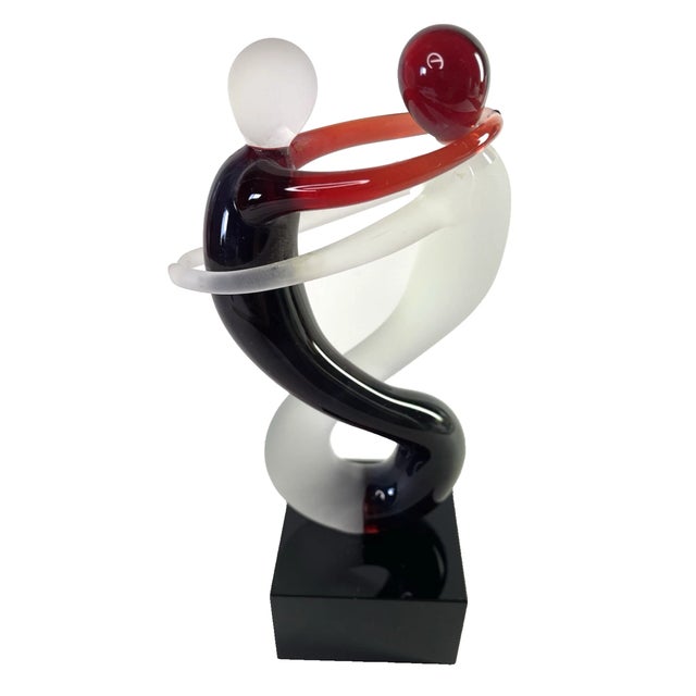 Bring romance and timeless elegance to your space with this stunning Murano-style handcrafted art glass lovers sculpture....