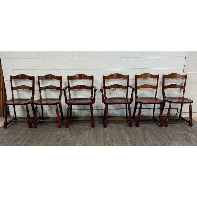This is a stunning set of six vintage Colonial Revival or Early American style walnut dining chairs, including two...