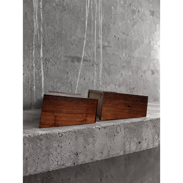 Pair of Danish wall-mounted bedside tables in richly figured rosewood, attributed to Melvin Mikkelsen Møbler, c. 1960s....