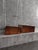 Pair of Danish wall-mounted bedside tables in richly figured rosewood, attributed to Melvin Mikkelsen Møbler, c. 1960s....