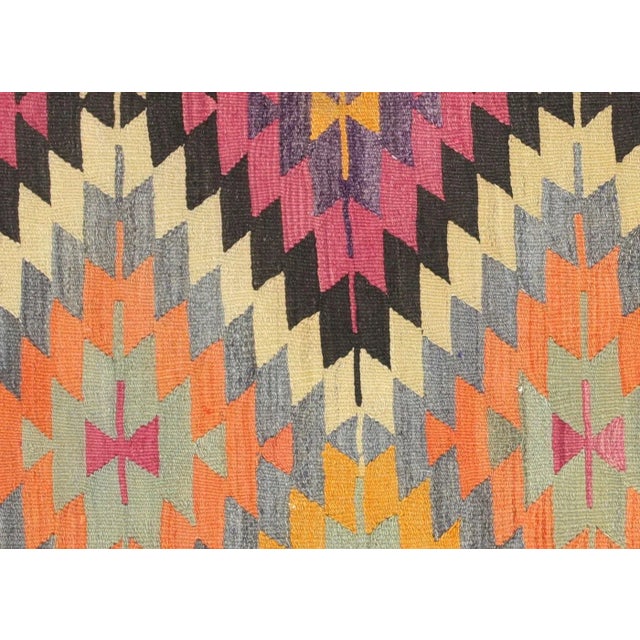 Bring a unique and traditional style to your home with this handcrafted Vintage Turkish Kilim. Boasting a classic wool-on-...