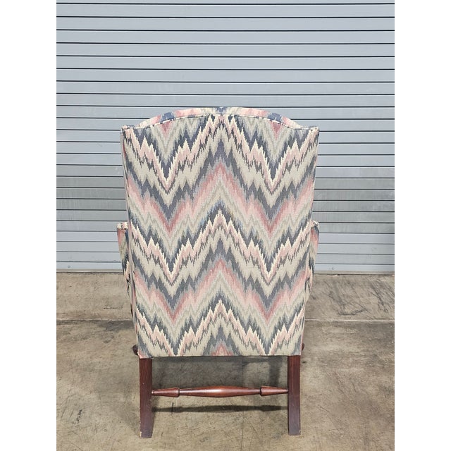 Store Item: Mahogany Williamsburg Queen Anne Style Wing Back Chair New Flame Stitched Fabric Description: Chairs feature a...
