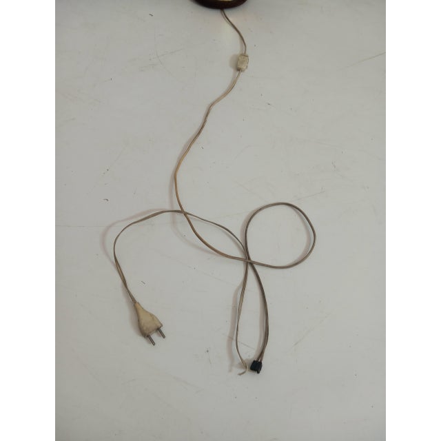 Bring a touch of mid-century charm to your space with this vintage table lamp from the 1960s, crafted in elegant brass...