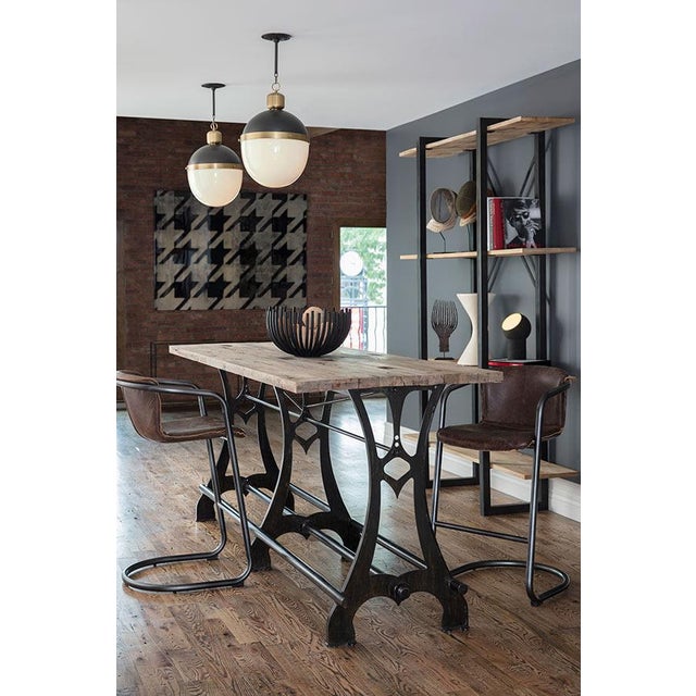 Commanding tradition and style, our Otis Pendant features a bold collaboration of metal and frosted glass—suspended by an...