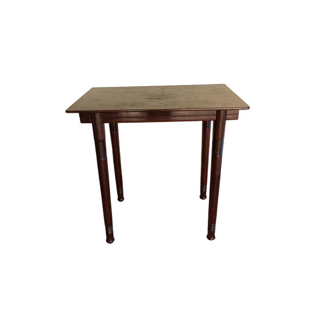 This vintage 1920s desk is crafted from mahogany by the vienna firm jacob & josef kohn, in the style of designer josef...