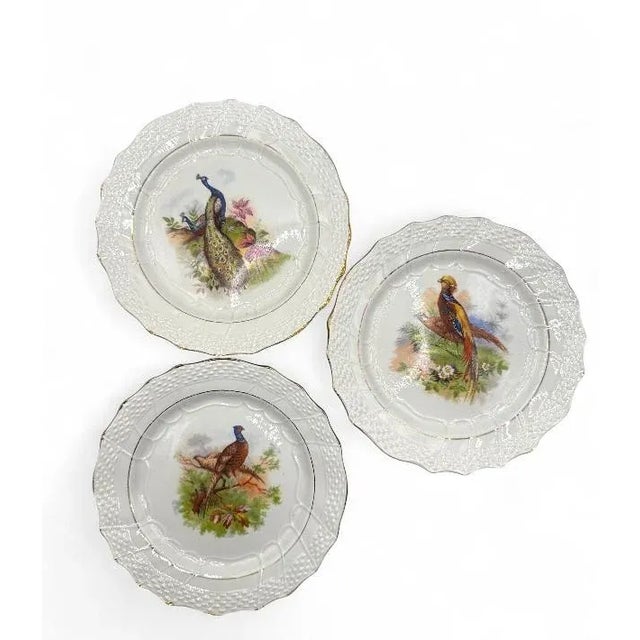 A stunning collection of twelve antique French dessert plates by&nbsp;Moulin des Loups Hamage, each beautifully...