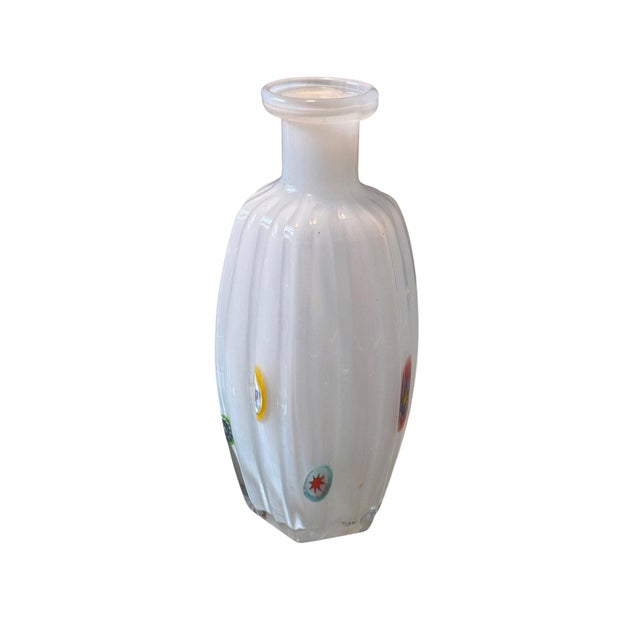 A charming Mid Century Italian Murano glass vase dating to circa 1960s.. The hand blown vessel has an elongated oval body,...
