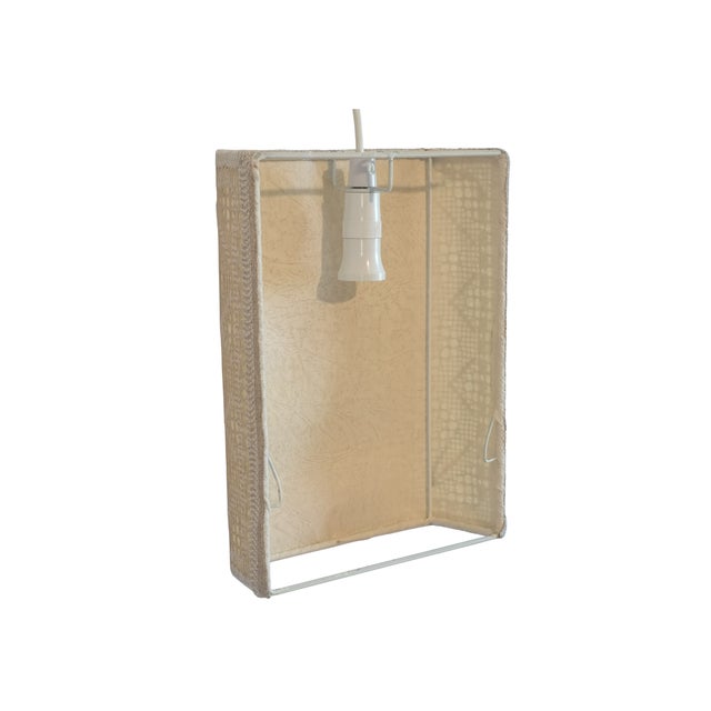 A hand-worked embroidery fabric wall light designed and produced in Sweden, 1960s. The square panel carries a geometric...