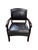 Handsome upholstered armchair combining a rich espresso-brown wood frame with black leather upholstery and bold,...