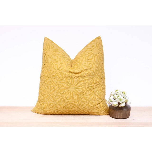 This vibrant decorative pillow cover features beautiful array of patterns, with hand crafted appliqué cut work, giving it...