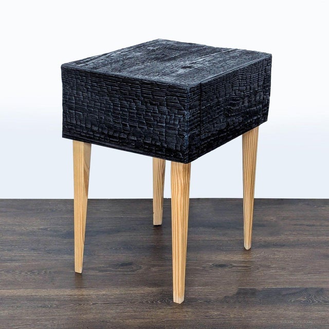 A single drawer modern interpretation of the traditional bedroom mainstay is rendered in charred Loblolly Pine; with...