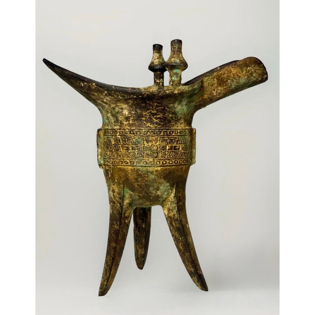 19th century large "Archaistic style" Chinese iron ritual wine vessel or jue. Beautifully patinated with traces of...