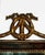 Antique French Louis XVI-style mirror features a rich wood frame accented with ornate, hand-carved parcel-gilt...
