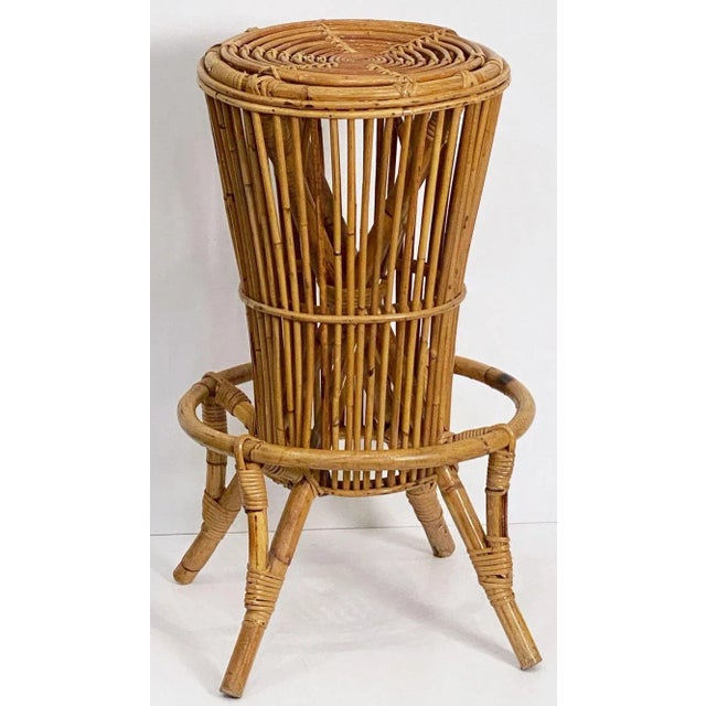 A fine vintage Italian bar stool from the Mid-20th century of woven rattan and bamboo featuring a stylish design to the...