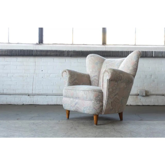 Beautiful 1950s Danish easy chair in the style of Fritz Hansen. Very elegant with distinct shape, precise lines and...