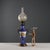 Blue porcelain oil lamp with pure gold decorations and gilded bronze elements. The lamp base is shaped like a cup with...